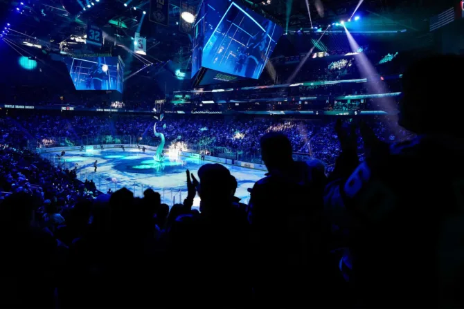 Fans watching the Kraken at Climate Pledge Arena