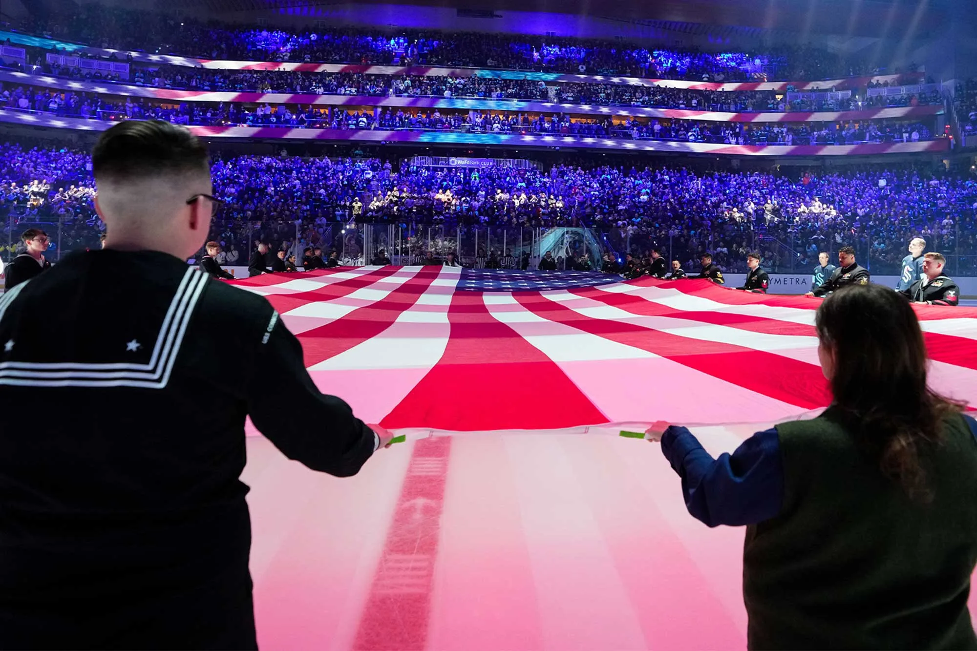 Service members at a Seattle Kraken game